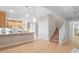 Spacious kitchen and stairway with hardwood floors at 4724 Ludwell Branch Ct, Raleigh, NC 27612