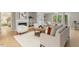 Bright living room featuring modern furniture, a marble fireplace, and lots of natural light at 4724 Ludwell Branch Ct, Raleigh, NC 27612