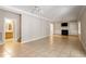 Open-concept living area featuring tile floors, a fireplace, and access to a bathroom at 4724 Ludwell Branch Ct, Raleigh, NC 27612