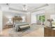 Spacious main bedroom featuring hardwood floors and a tray ceiling at 4724 Ludwell Branch Ct, Raleigh, NC 27612
