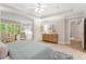 Bright main bedroom featuring sitting area and neutral tones at 4724 Ludwell Branch Ct, Raleigh, NC 27612