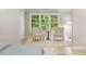 Bedroom seating area with chairs in front of a large window view at 4724 Ludwell Branch Ct, Raleigh, NC 27612