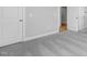 Neutral bedroom showcasing soft gray carpet, white trim, and natural light at 4896 Grosbeak Ct, Mebane, NC 27302