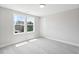 Bright bedroom featuring carpet, natural light, and views of the community at 4896 Grosbeak Ct, Mebane, NC 27302