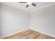 Cozy bedroom featuring hardwood floors, neutral paint, ceiling fan and ample natural light at 4896 Grosbeak Ct, Mebane, NC 27302