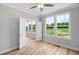 Cozy bedroom featuring hardwood floors, neutral paint, ceiling fan and ample natural light at 4896 Grosbeak Ct, Mebane, NC 27302