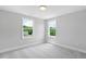 Bright bedroom featuring carpet, natural light, and views of the community at 4896 Grosbeak Ct, Mebane, NC 27302