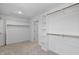 Walk-in closet with custom shelving and rod system at 4896 Grosbeak Ct, Mebane, NC 27302