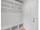 Entryway featuring custom built-in shelving, storage, and a white door at 4896 Grosbeak Ct, Mebane, NC 27302