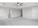 Spacious main bedroom featuring carpet, neutral paint, ceiling fan, tray ceiling and ample natural light at 4896 Grosbeak Ct, Mebane, NC 27302
