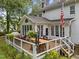 The outdoor deck features a grill, dining set, and seating with views of the backyard at 5109 Makena Dr, Raleigh, NC 27615