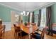 Spacious dining room featuring hardwood floors and large windows at 5109 Makena Dr, Raleigh, NC 27615