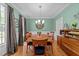 Formal dining room with hardwood floors, classic decor, and ample natural light at 5109 Makena Dr, Raleigh, NC 27615