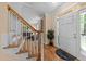 Bright entryway with hardwood floors and a staircase leading to the upper level at 5109 Makena Dr, Raleigh, NC 27615