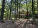Charming brick two-story home with a manicured lawn and mature trees at 5109 Makena Dr, Raleigh, NC 27615