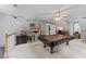 A spacious game room features a pool table, and unique decor to match the aesthetic at 5109 Makena Dr, Raleigh, NC 27615