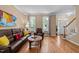 Cozy living room with hardwood floors and access to the staircase at 5109 Makena Dr, Raleigh, NC 27615
