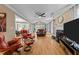 Open living room with hardwood floors, fireplace, and lots of natural light at 5109 Makena Dr, Raleigh, NC 27615