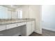 Bathroom featuring a vanity with granite countertops, white cabinets, and a glass-enclosed shower at 5330 River Reach Dr, Raleigh, NC 27616
