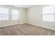 Bedroom with neutral-toned walls and plush carpet, offering a cozy and inviting space at 5334 River Reach Dr, Raleigh, NC 27616