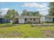 The spacious backyard offers a fenced garden area, and greenery at 555 Dacian Rd, Raleigh, NC 27610