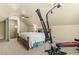 Bright bedroom with a bed, ceiling fan, and exercise machine at 59 Carrousel Ct, Angier, NC 27501