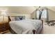 Bedroom featuring a cozy bed with decorative pillows and a floral comforter, plus a ceiling fan at 59 Carrousel Ct, Angier, NC 27501