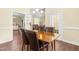 Open-concept dining area with views to the kitchen, breakfast bar, and living area at 59 Carrousel Ct, Angier, NC 27501