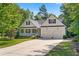 Charming single-story home with a well-manicured lawn, covered porch, and two-car garage at 59 Carrousel Ct, Angier, NC 27501