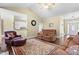 Spacious living room featuring hardwood floors, an open layout, and access to the kitchen at 59 Carrousel Ct, Angier, NC 27501