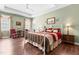 Spacious main bedroom features hardwood floors, tray ceilings, and ample natural light at 59 Carrousel Ct, Angier, NC 27501