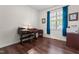 Bright office with a traditional desk, chair, and dark wood flooring under a large window at 59 Carrousel Ct, Angier, NC 27501