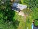 Aerial view showcasing the home's roof, backyard, and surrounding trees, offering privacy at 603 Nellane Dr, Garner, NC 27529