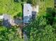 Aerial view of the property, showing the roof, driveway and surrounding landscape with mature trees at 603 Nellane Dr, Garner, NC 27529