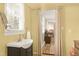 Bright bathroom featuring a vessel sink, window with blinds, and yellow walls at 603 Nellane Dr, Garner, NC 27529