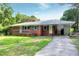 Traditional brick home with a convenient carport and landscaped front yard at 603 Nellane Dr, Garner, NC 27529
