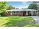 Charming single-story brick home with well-maintained lawn and inviting carport at 603 Nellane Dr, Garner, NC 27529