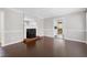 Spacious living room featuring a classic fireplace and stylish hardwood floors at 603 Nellane Dr, Garner, NC 27529