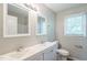 Bathroom with double sinks, new faucets, two mirrors, and updated toilet at 605 Sexton Ave, Zebulon, NC 27597
