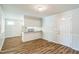 Open-concept dining area features wood-look flooring and plenty of natural light at 605 Sexton Ave, Zebulon, NC 27597