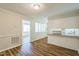 The spacious kitchen features a breakfast bar, eat-in area, and new wood-look flooring at 605 Sexton Ave, Zebulon, NC 27597