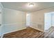 Spacious room features fresh paint, updated wood-look flooring, and ample lighting at 605 Sexton Ave, Zebulon, NC 27597