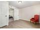 Bedroom with hardwood floors, access to the Living Room, and bright natural light at 611 Rowland St, Henderson, NC 27536