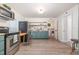 Spacious kitchen featuring stainless steel appliances, butcher block counters and easy access to laundry room at 611 Rowland St, Henderson, NC 27536
