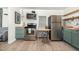 Updated kitchen featuring stainless steel appliances, butcher block countertops, and stylish decor at 611 Rowland St, Henderson, NC 27536