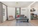 Open floor plan living room which flows into the kitchen featuring hardwood floors and lots of natural light at 611 Rowland St, Henderson, NC 27536