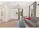 Bright living room featuring wood floors, modern lighting, and neutral furniture with stylish decor at 611 Rowland St, Henderson, NC 27536