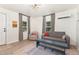Bright living room featuring wood floors, modern lighting, and neutral furniture with stylish decor at 611 Rowland St, Henderson, NC 27536