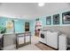 Eat-in kitchen showcases laundry area, unique blue walls, and access to living room and back porch at 625 Columbia Ave, Burlington, NC 27217