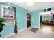 Bright eat-in kitchen featuring blue walls, white trim, and modern fixtures with a vintage aesthetic at 625 Columbia Ave, Burlington, NC 27217